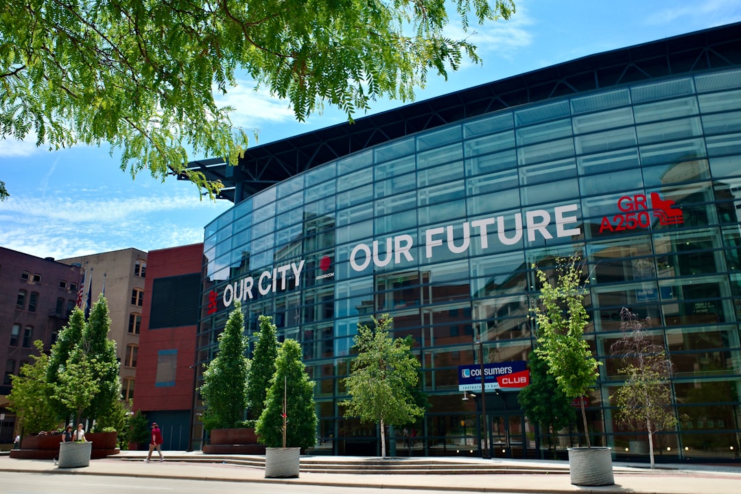 Modern glass building facade with 'our city our future' slogan.
